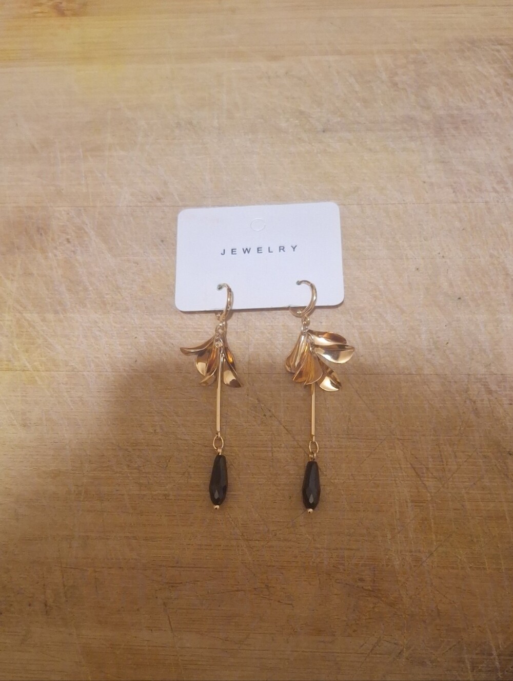 Gold Floral Drop Earrings with Black Bead